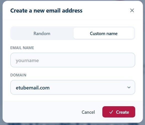 Tmailor Create a new email address dialog on the Custom name tab with an Email name field and a Domain dropdown